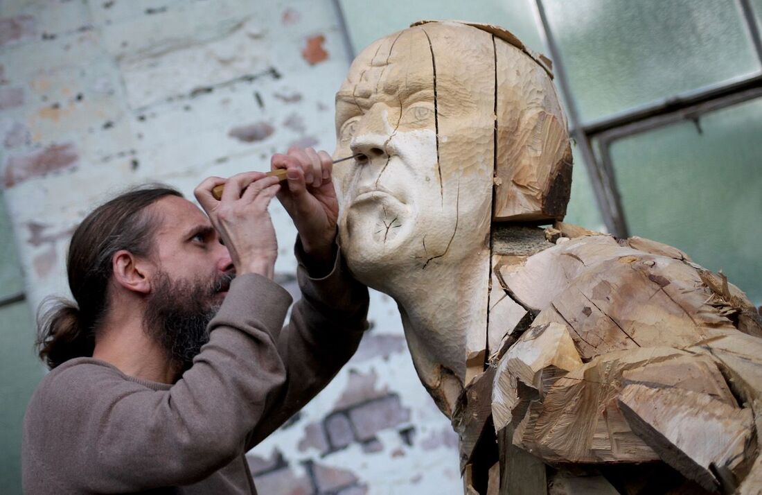 Man sculpting wood